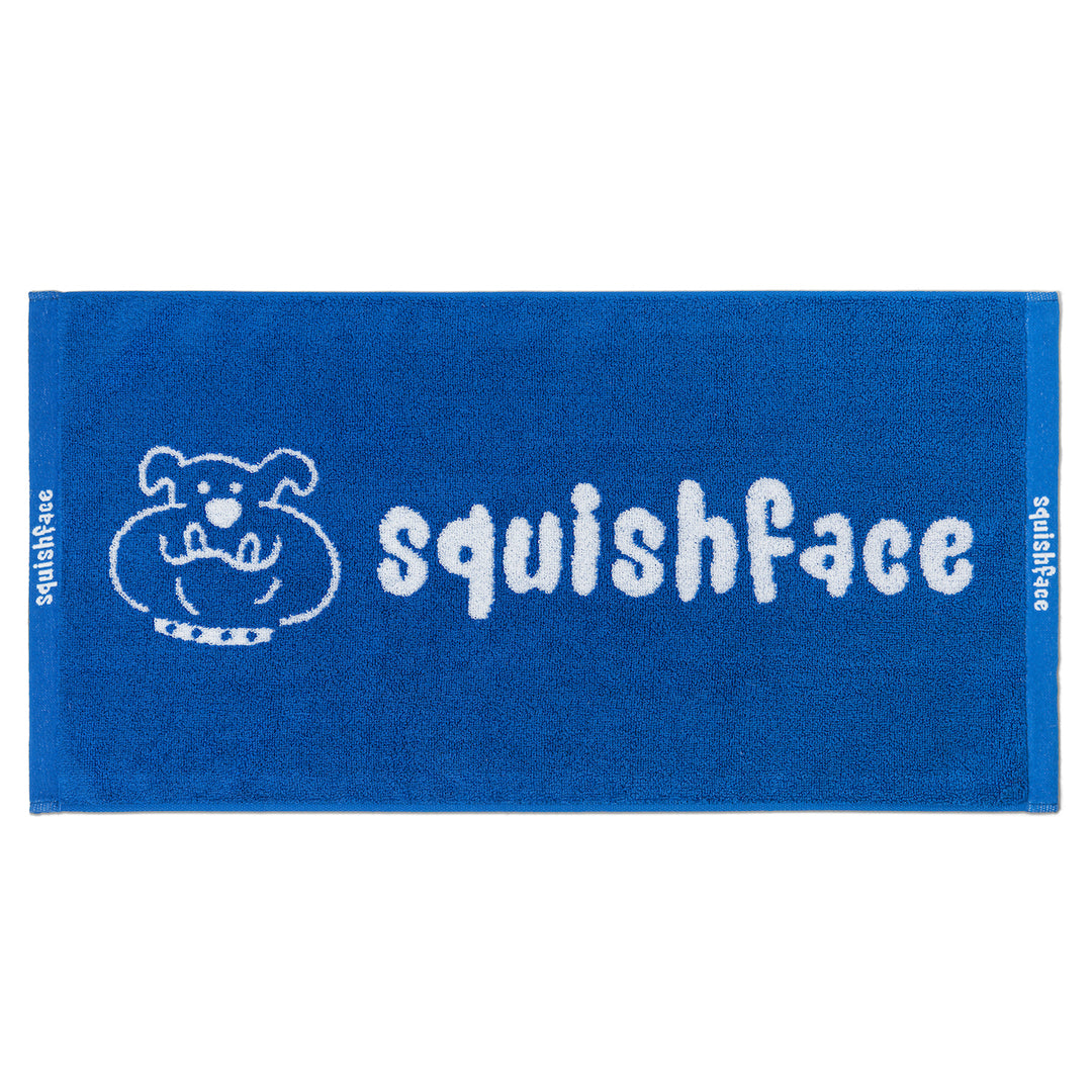 Blue towel with 'squishface' logo on a white background