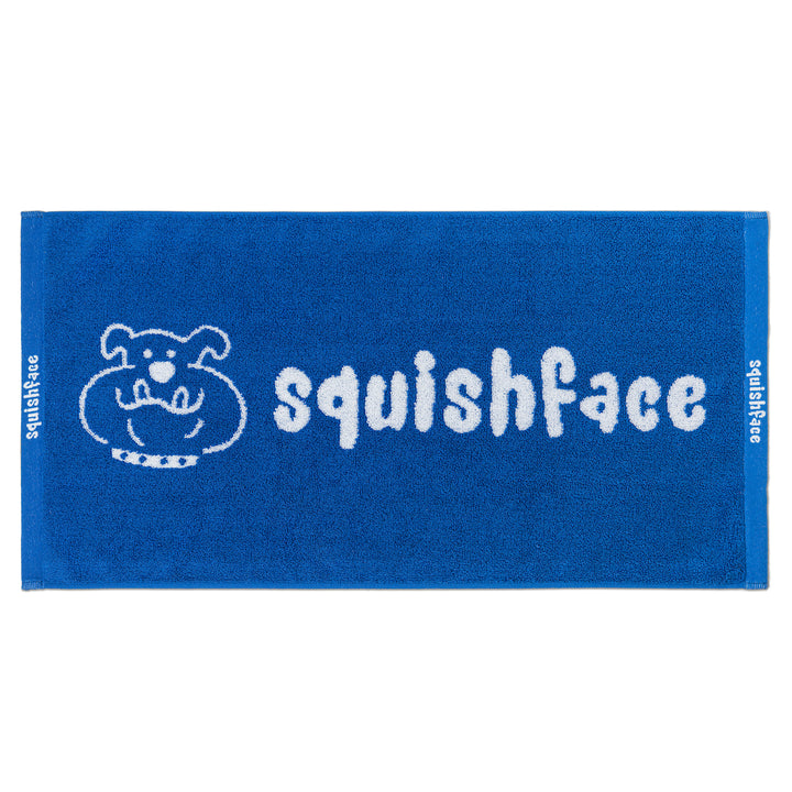 Blue towel with 'squishface' logo on a white background