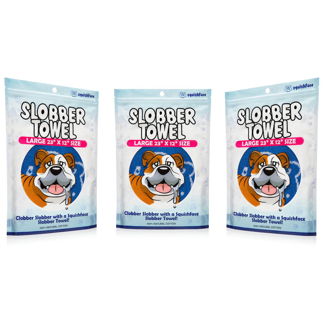 Three packages of Slobber Towel with a cartoon dog on the packaging.