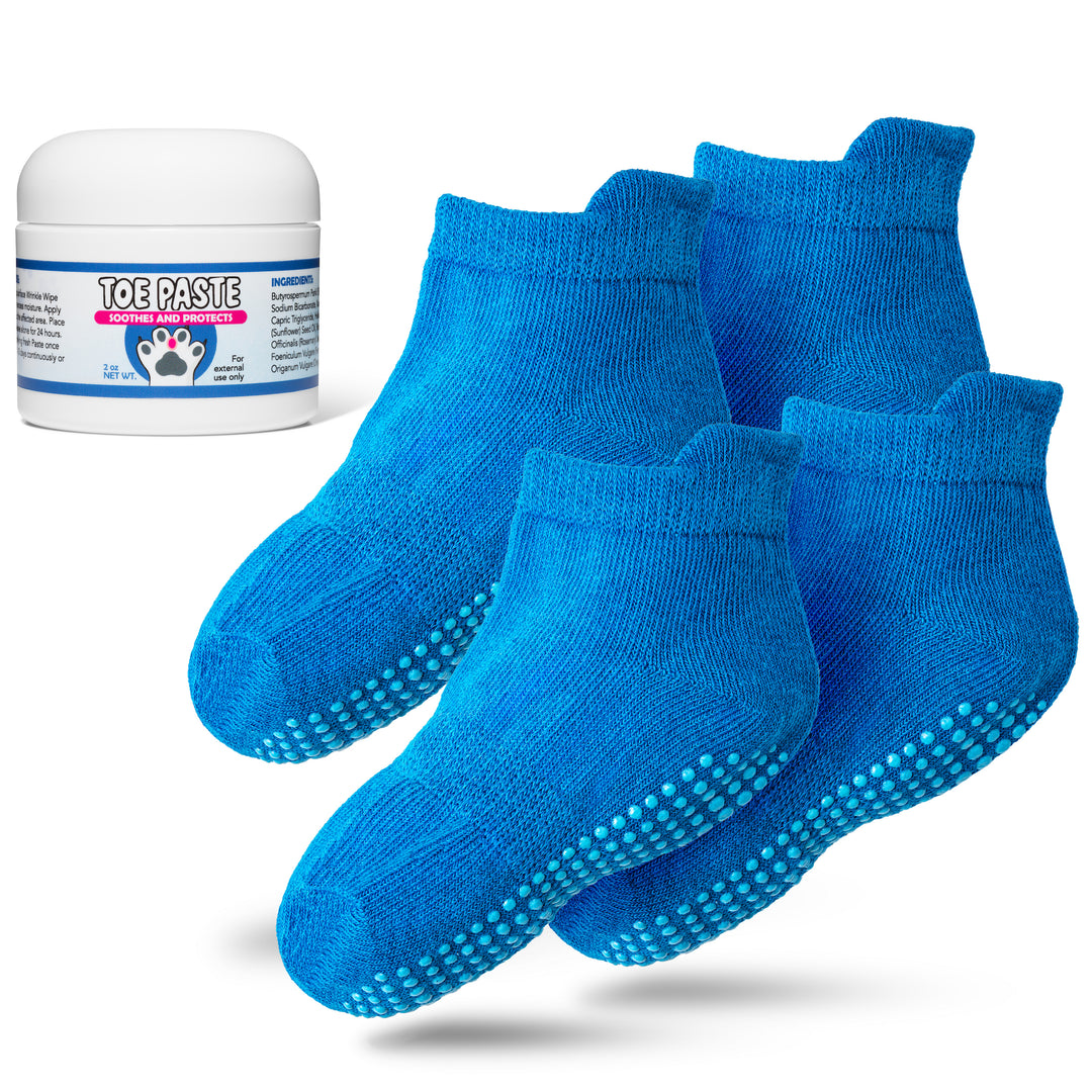 Blue socks with textured sole and a container labeled 'Toe Paste' on a white background